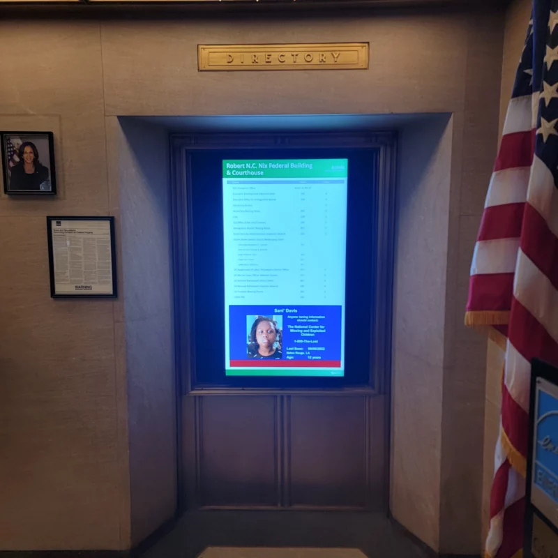 Vertical digital building directory mounted in alcove in lobby of Robert N. C. Nix Federal Building and U.S. Courthouse in Philadelphia, Pennsylvania. 