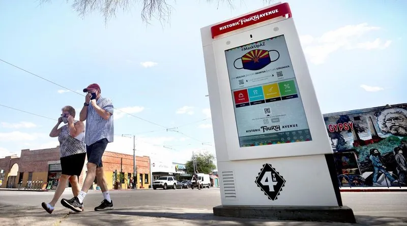 Historic district white outdoor information kiosk seen as way to revolutionize retail spaces. 