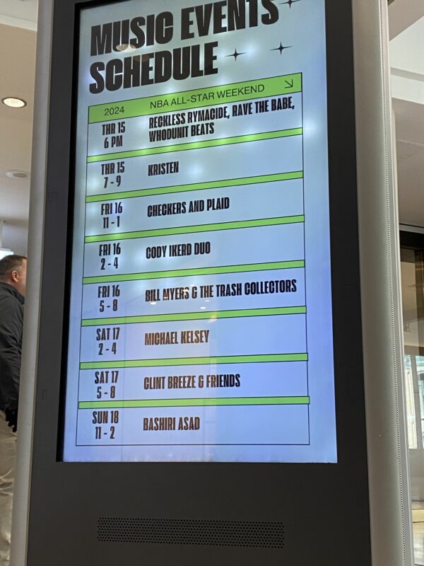 Digital kiosk at a mall that announces music series events