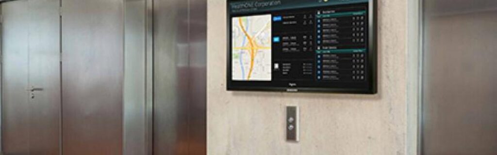 Digital directory next to elevator