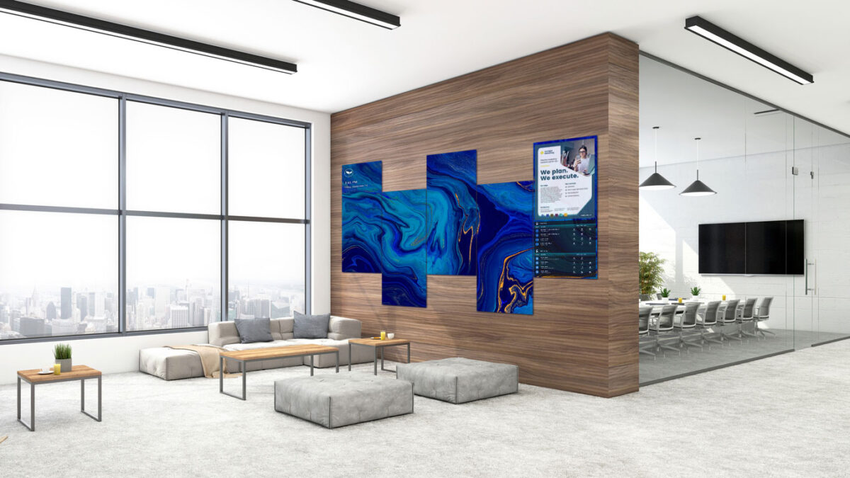 A custom configured indoor LED video wall located in an office lobby featuring blue wavy abstract digital art background.