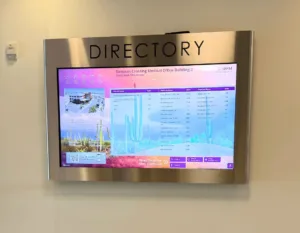 Wall-mounted digital directory signage in a medical office building brightly delivers practice, physician names and suite numbers to lost patients.