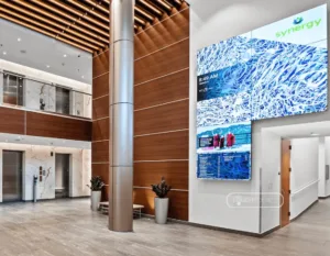 Mounted multi-screen video wall digital directory in medical office center alcove helps visitors navigate the campus while upgrading the patient experience.