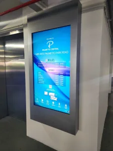 - TouchSource Digital directory screen in a wall panel showing directions to Palmetto Central, 1489 West Palmetto Park Road.